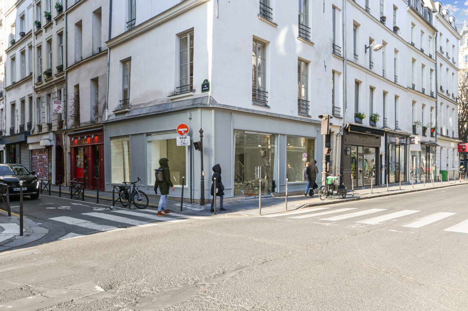 Wide exterior view of the corner storefront at 97 Rue de Turenne in Le Marais, Paris