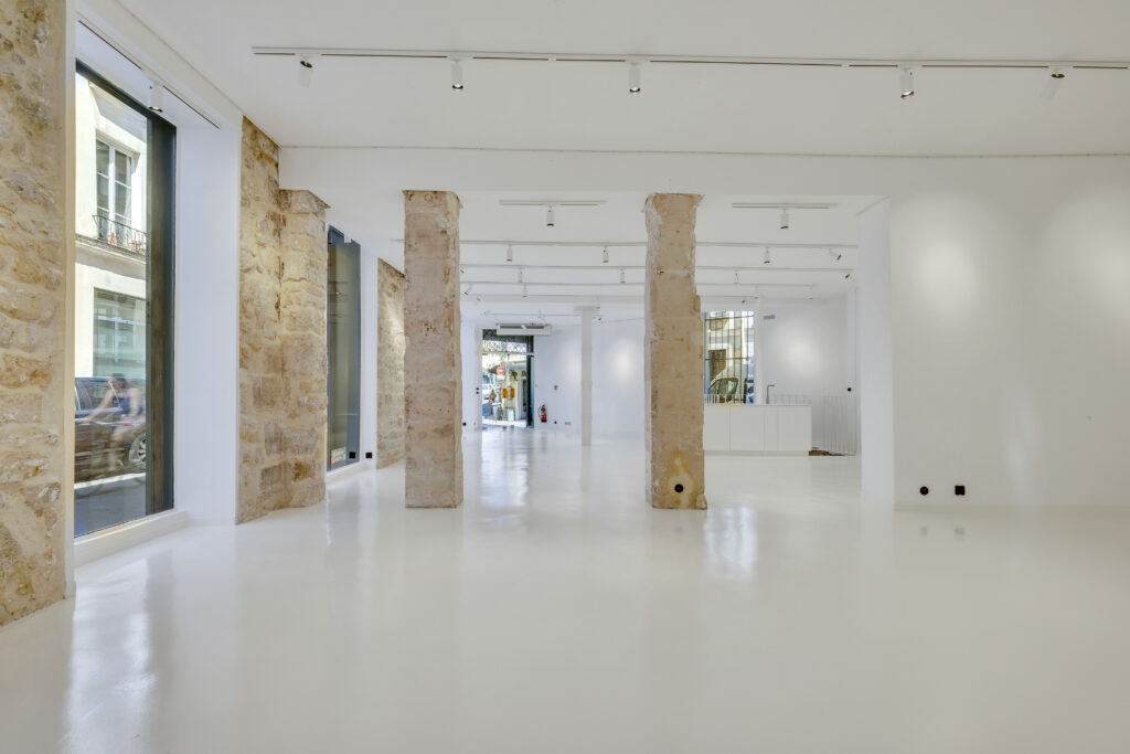 Interior perspective looking toward the entrance, 62 Rue Charlot showroom
