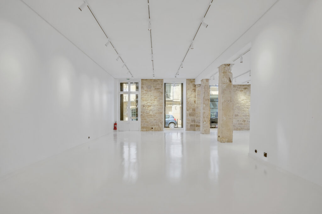 Secondary room looking toward windows in the 62 Rue Charlot showroom