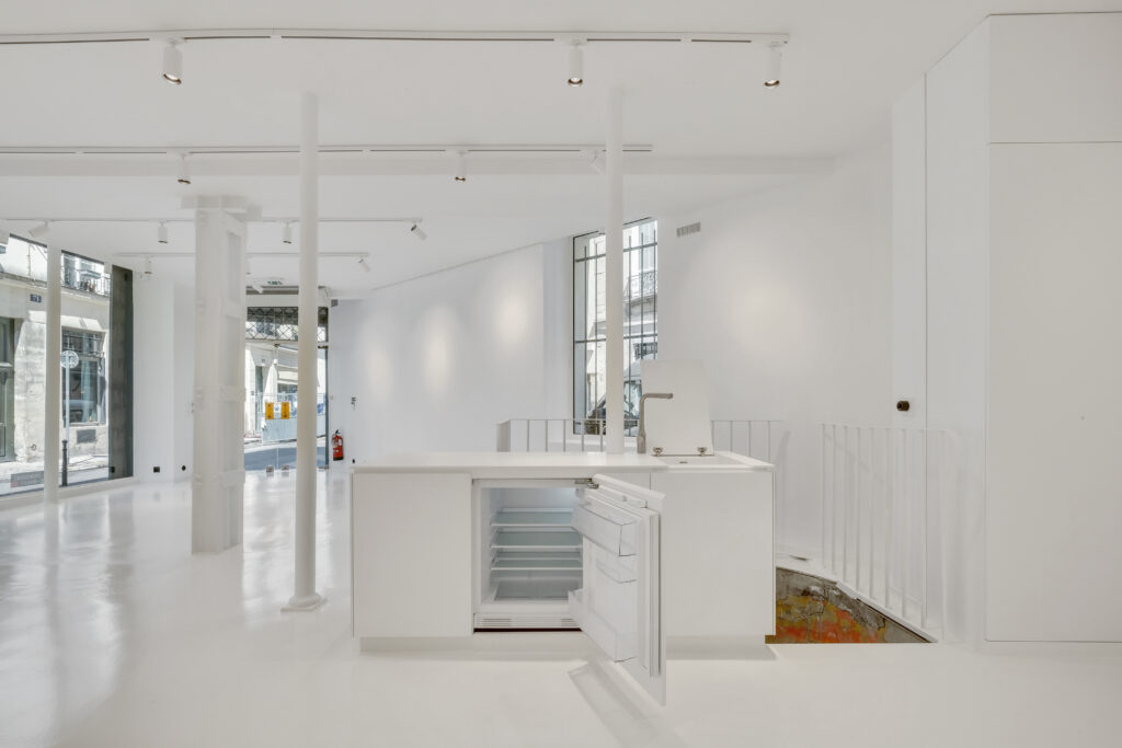 White counter and bar area inside 62 Rue Charlot showroom, Paris