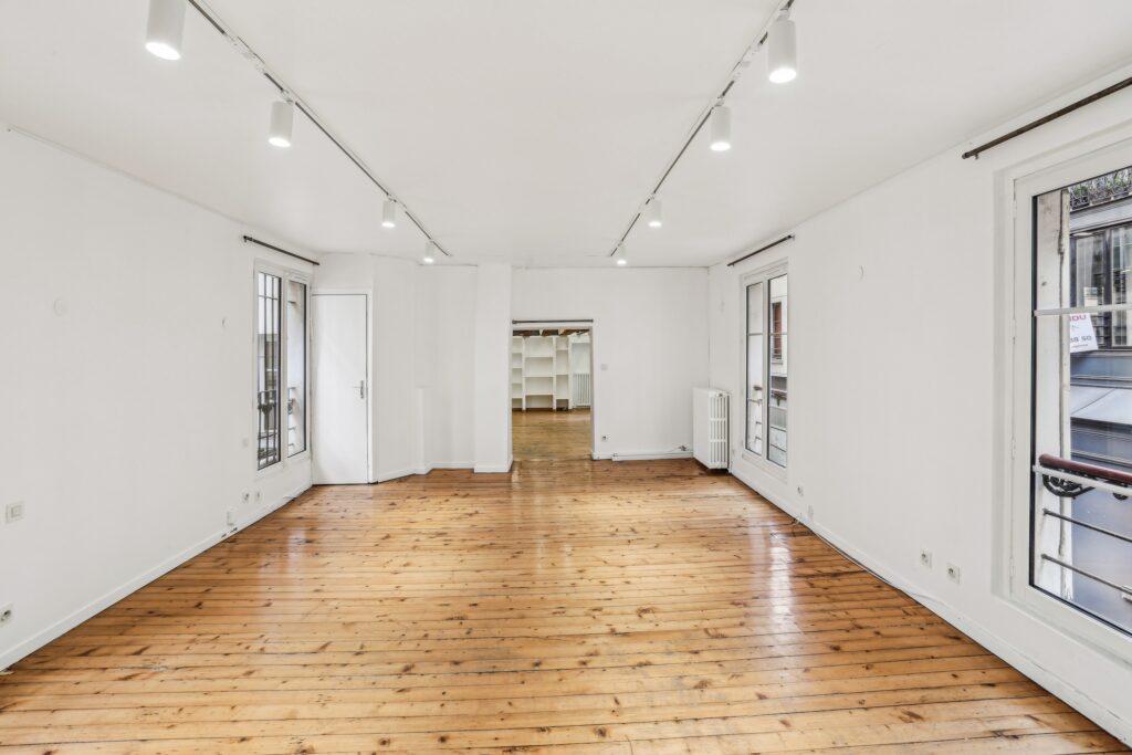 Spacious first floor showroom with wood floors.