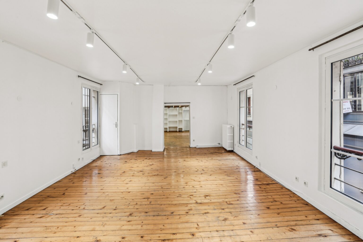 Spacious first floor showroom with wood floors.