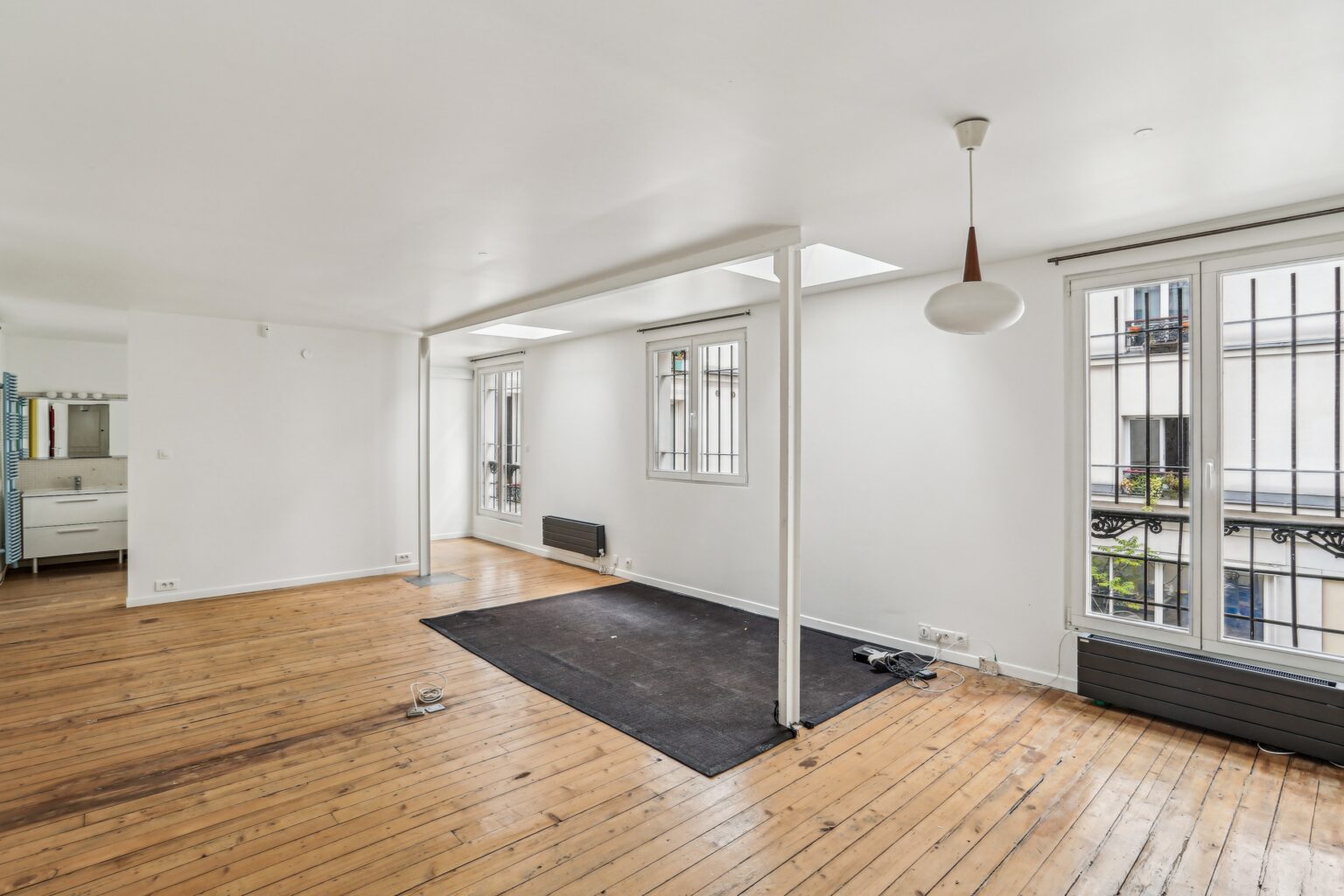 Loft showroom space with wooden beams.
