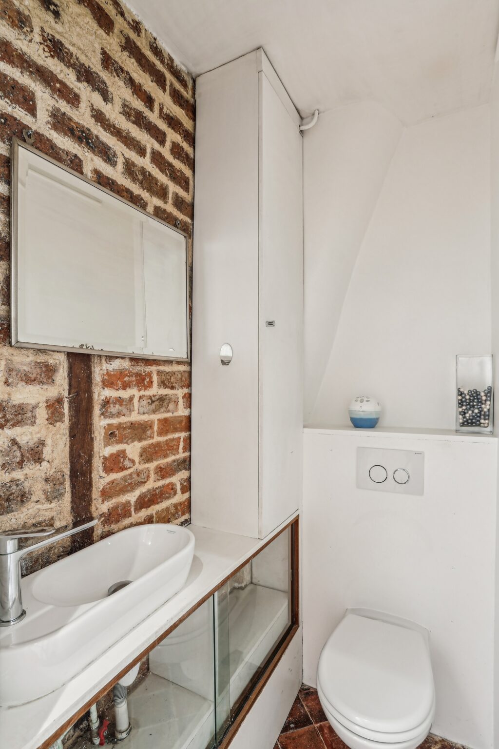 Ground floor WC with sink and mirror.