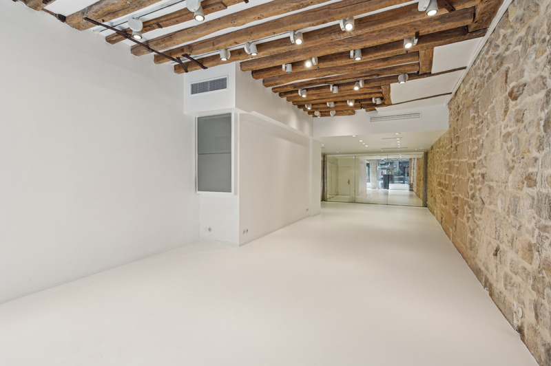 Deep gallery showroom space with exposed beams Rue de Turenne