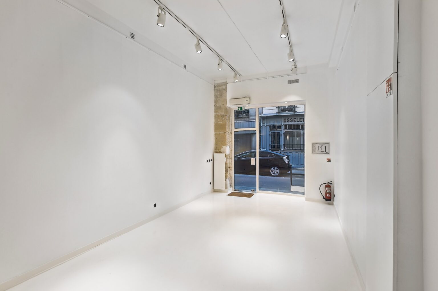 Interior sightline from entrance toward rear gallery space