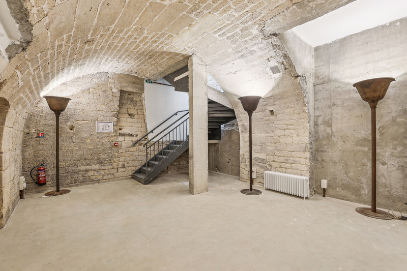 Stone vaulted cellar showroom space with staircase Sentier Paris venue