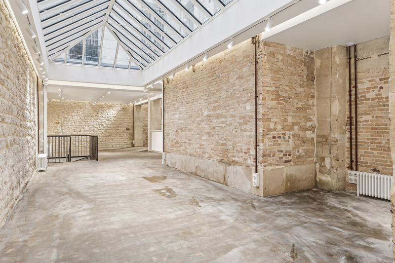 Showroom interior view toward storefront windows Sentier Paris gallery space