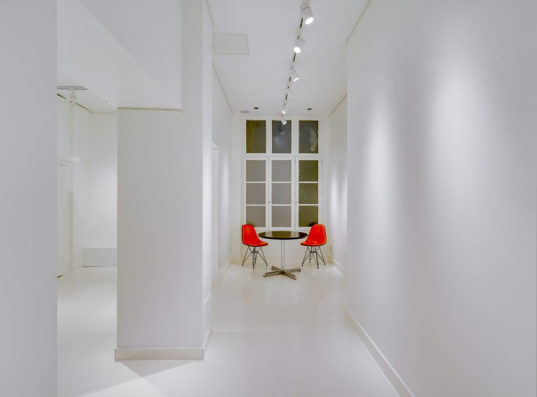 Entrance corridor with track lighting at 43 Rue Charlot showroom