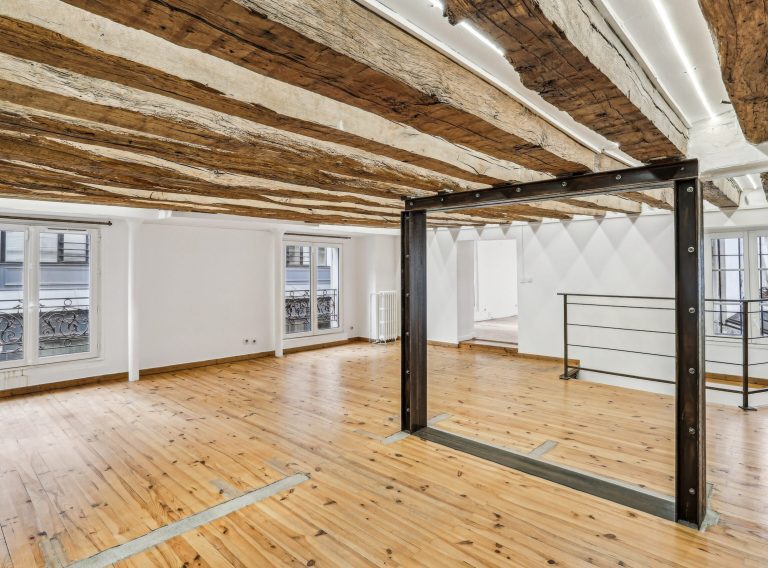 First-floor showroom with mezzanine frame and display shelving, Marais