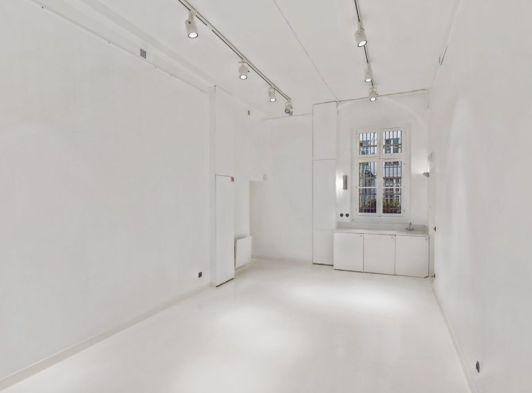 White-box showroom, back room with window and cabinets — 52 Rue Charlot, Marais