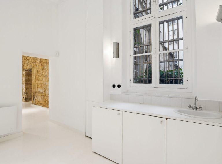 Compact kitchenette and storage — 52 Rue Charlot showroom, Marais